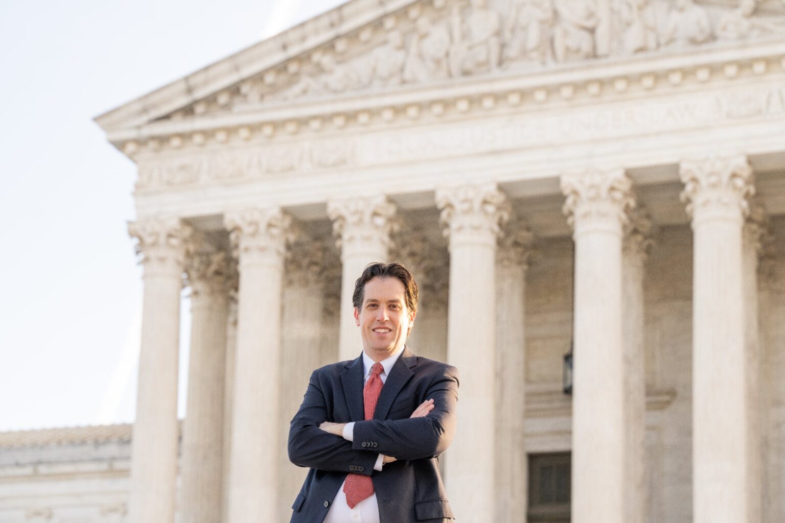 Attorney Adam Fomby in front of the U.S. Supreme Court building